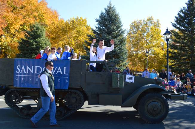 Gov. Brian Sandoval rides in the Nevada Day parade in Carson City on Oct. 26, 2013.